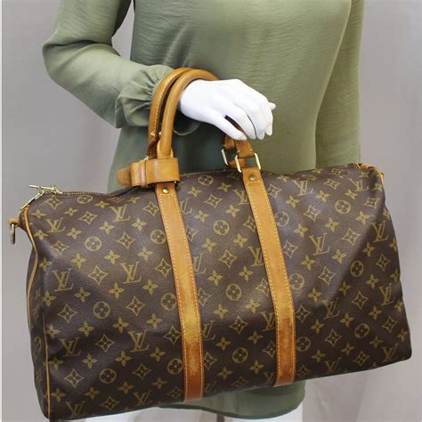 louis vuitton monogram keepall 45 bandouliere|louis vuitton empreinte keepall.